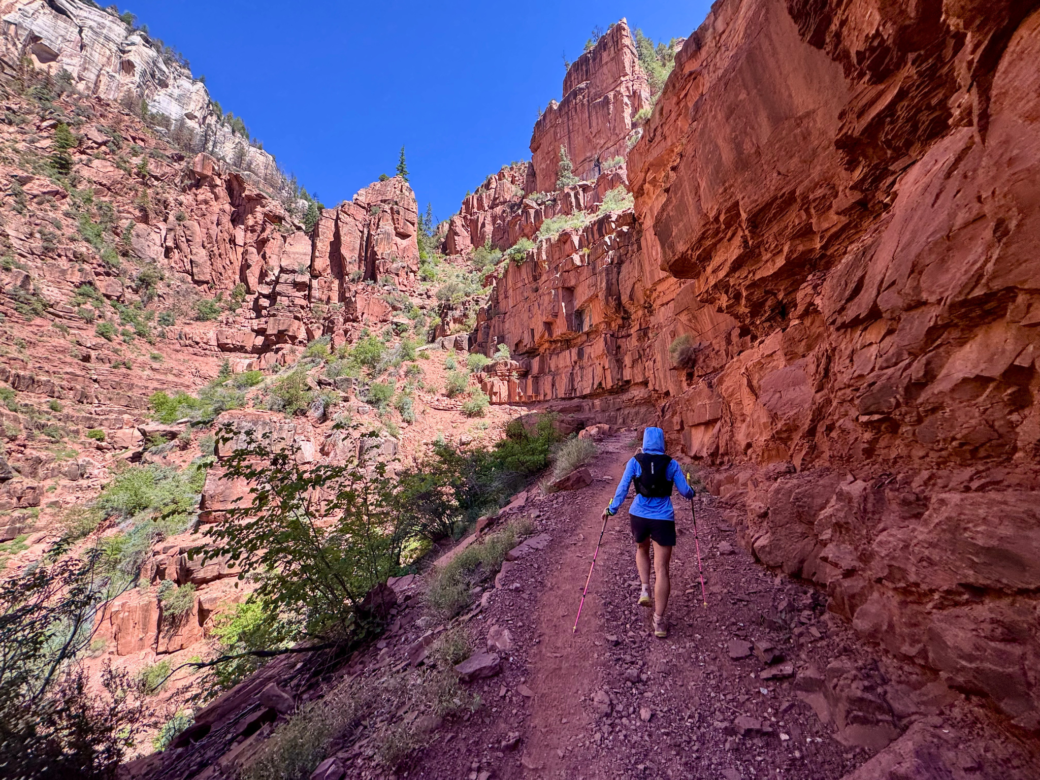 Emily climbing North Kaibab Trail through red rock