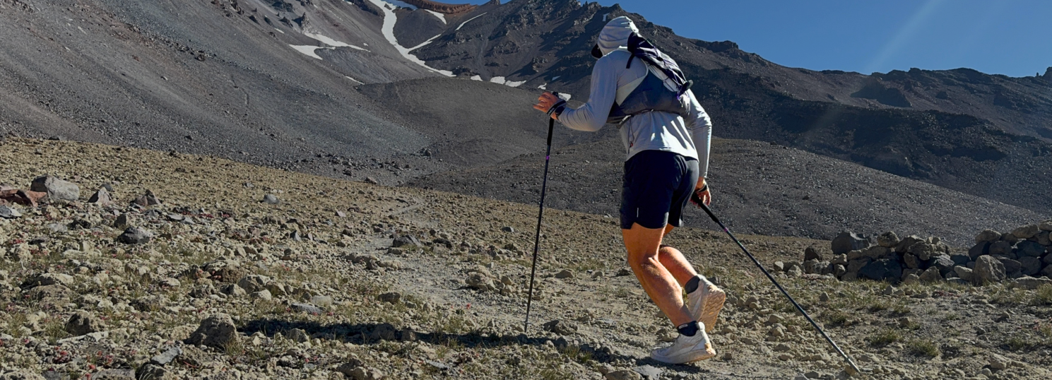 Panoramic mountain trail, hiker using trekking poles