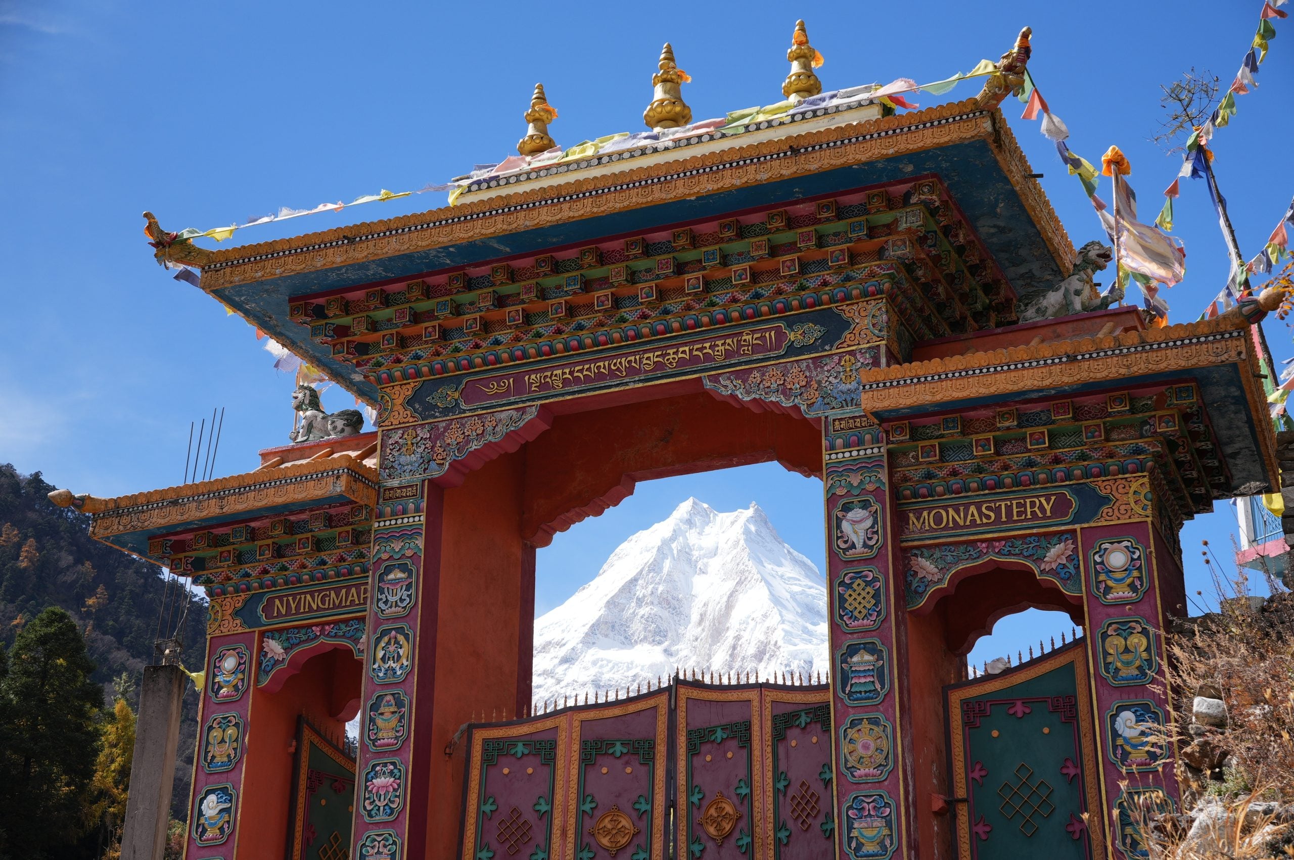 Manaslu framed by the gateway to a Nyingmapa monastery on the Manaslu Circuit